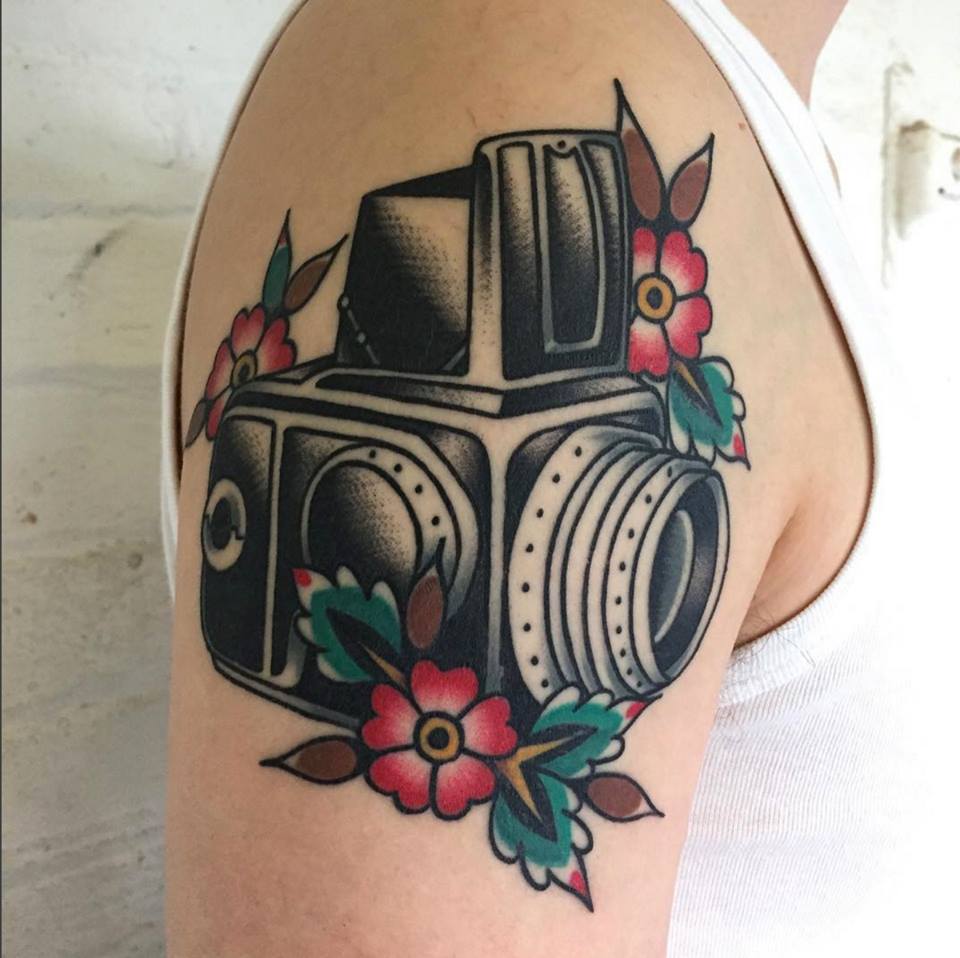 Camera tattoo by Chris Devine – 1920 Tattoo